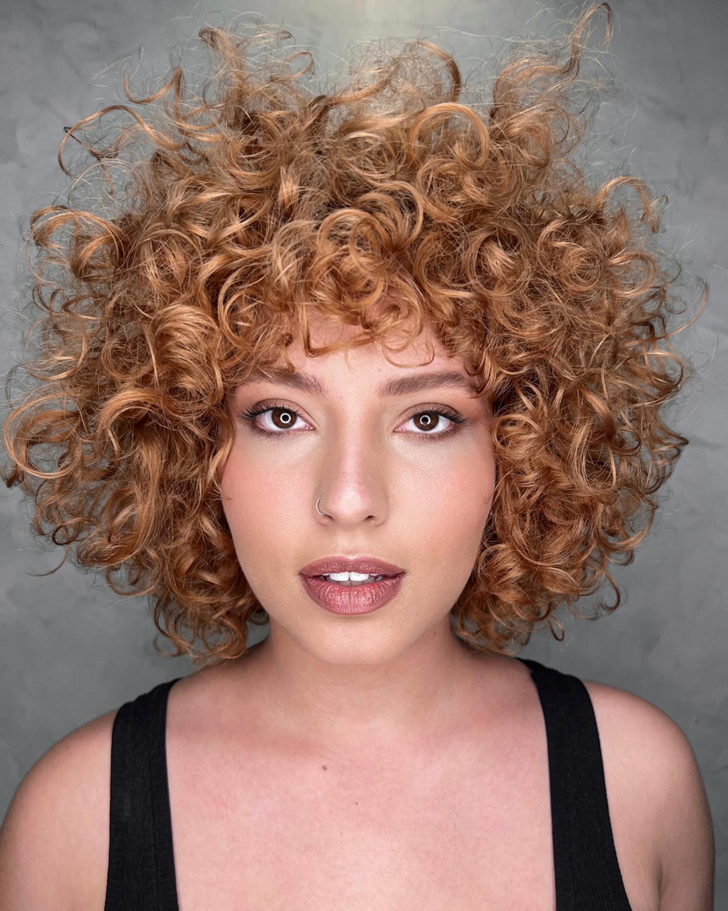 Curly Bob Cut with Bang on Blonde Hair