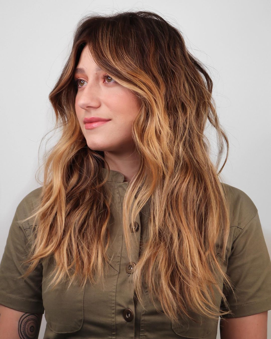 Strawberry Caramel Balayage on Long Wavy Hair