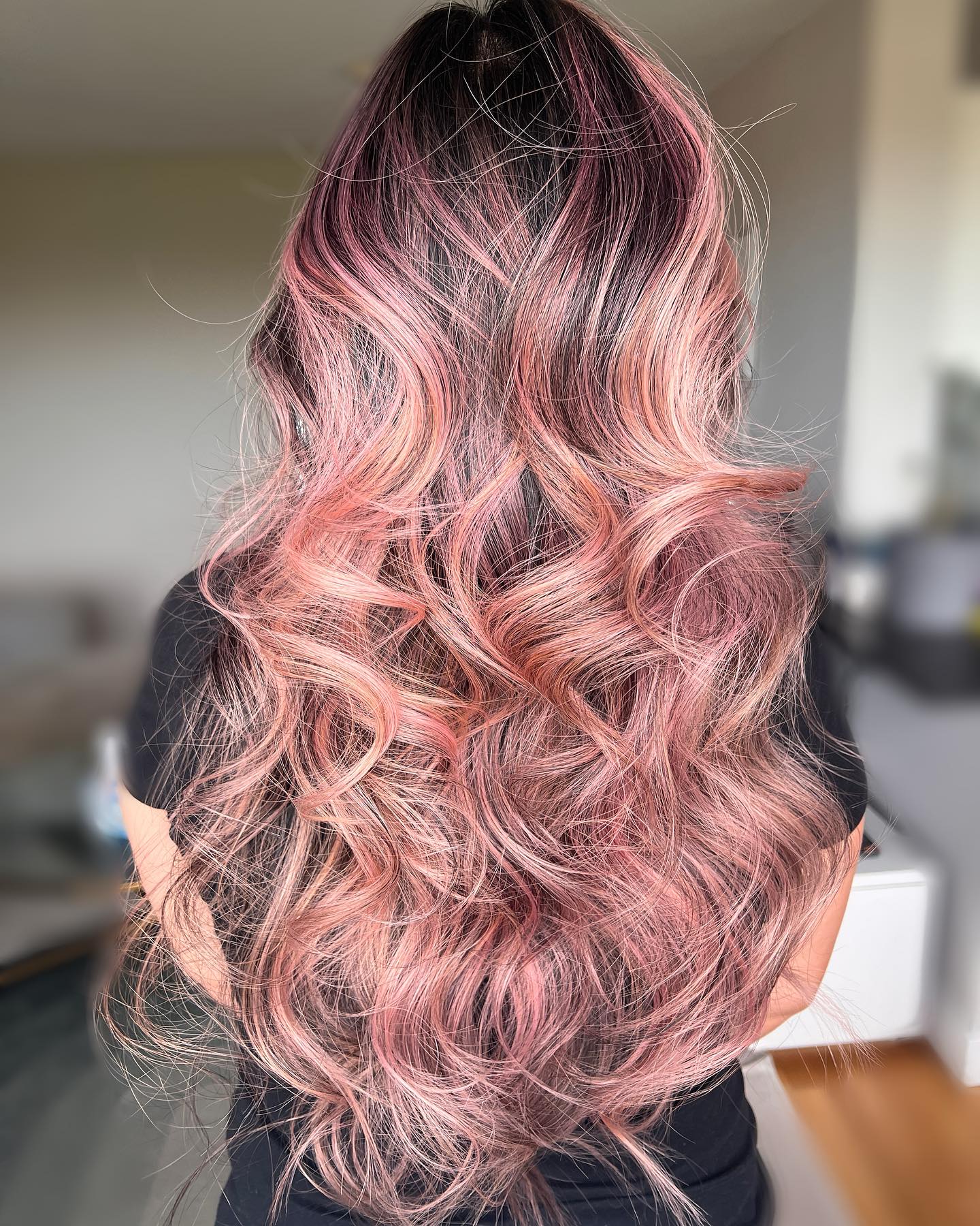 Rose Gold Highlights on Long Wavy Dark Hair