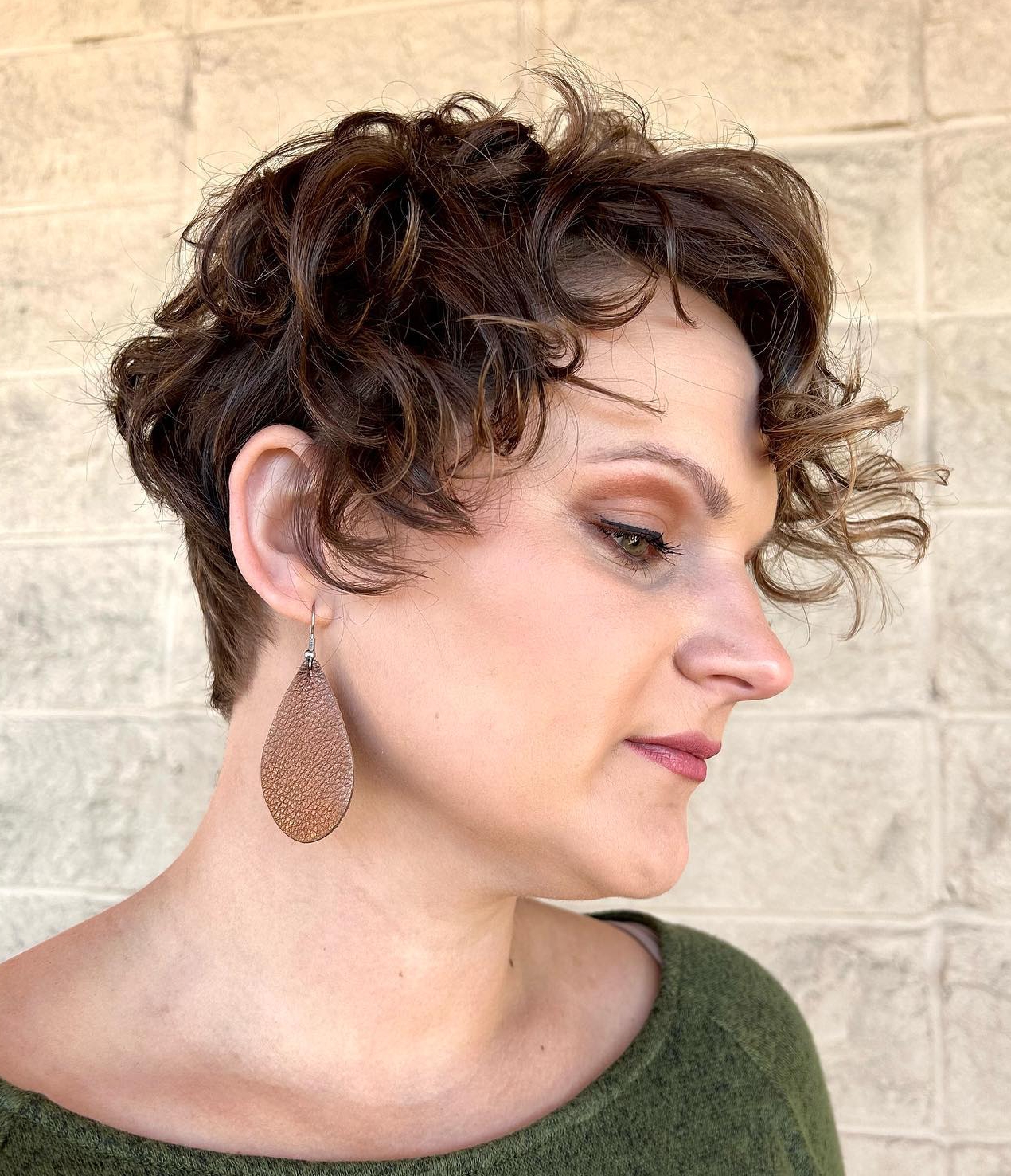 Short Curly Asymmetrical Pixie on Brown Hair