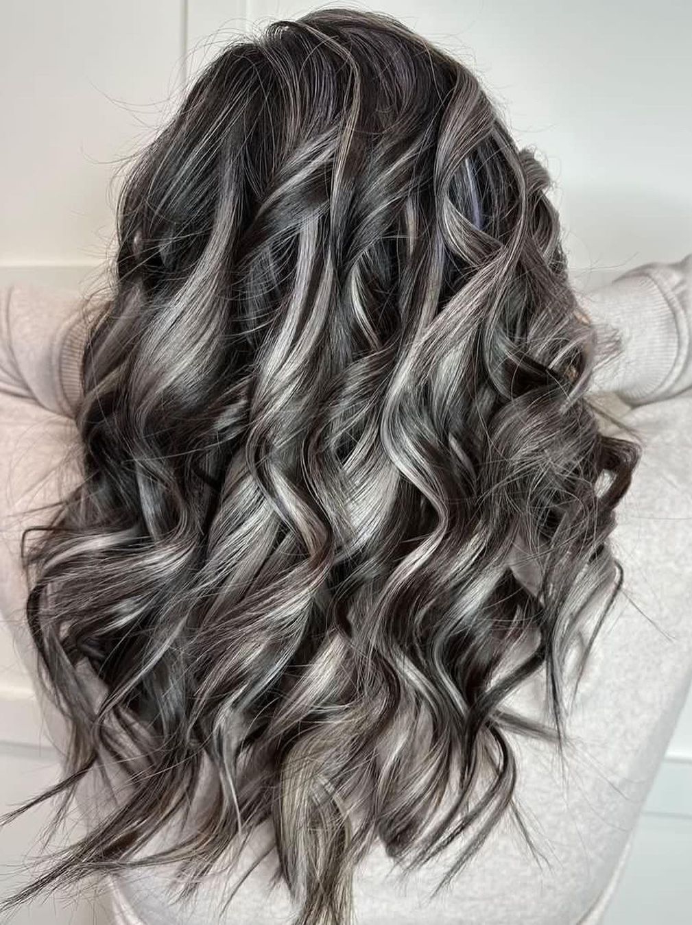 Silver Highlights on Long Black Wavy Hair