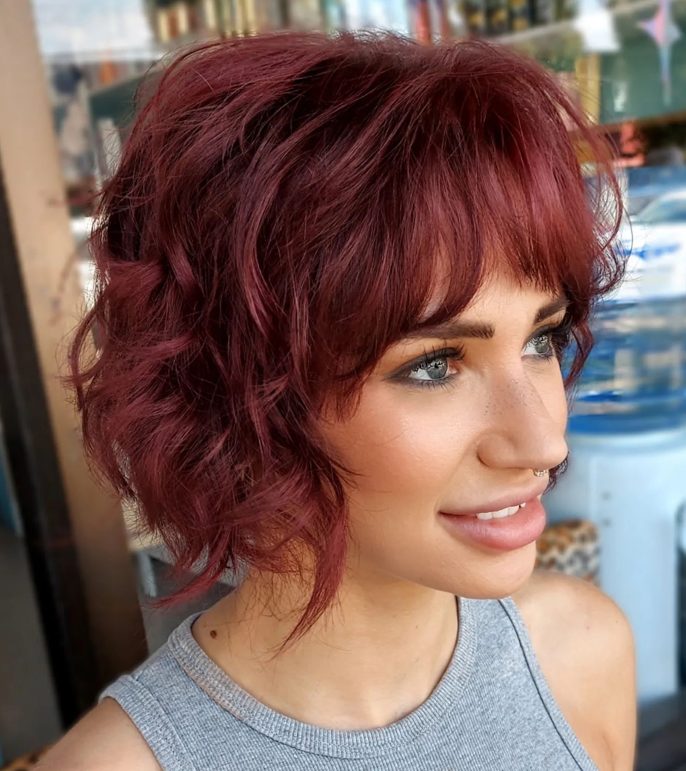 Short Bob Cut on Burgundy Hair with Wispy Bang