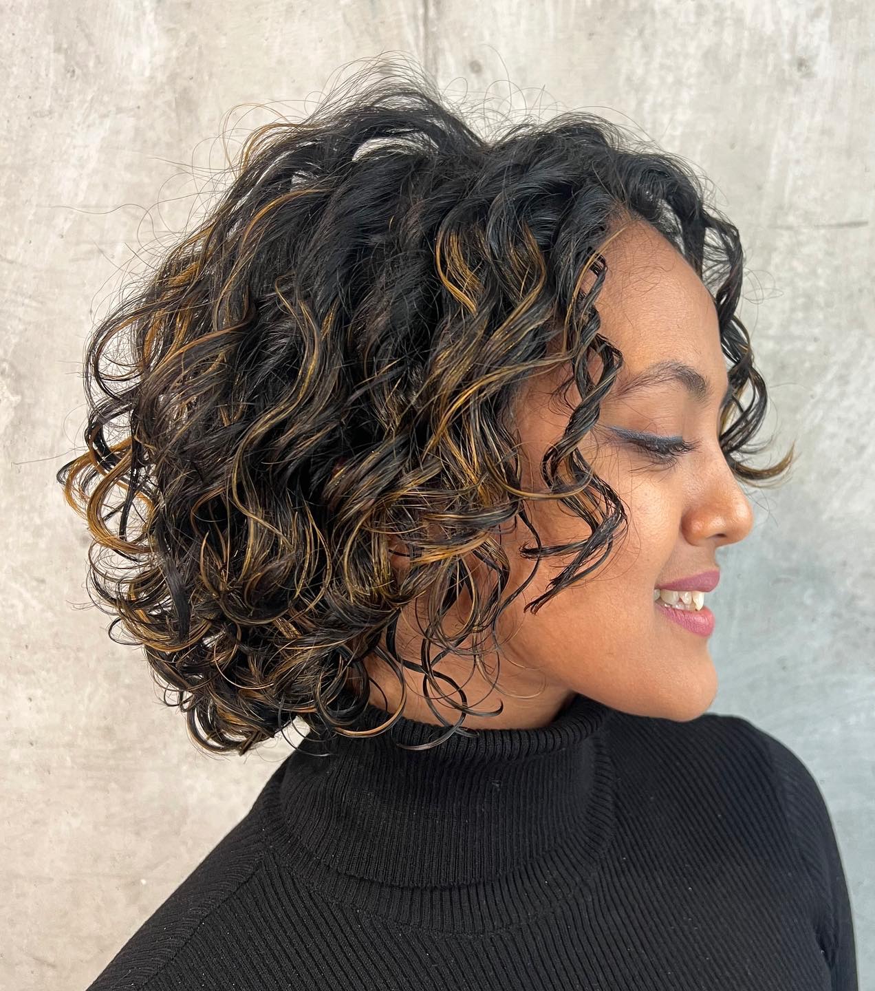 Short Black Curly Hair with Blonde Highlights